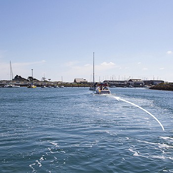 the sea with boats on a nice day